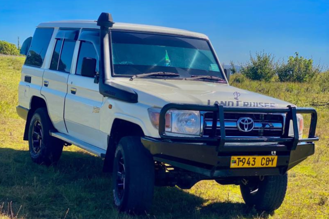 Image of a car named Toyota Land Cruiser Hardtop available for rental at Forbhic Travel with a description that says The Toyota Land Cruiser Hardtop is a legend in off-road capabilities. Its robust build and ample seating make it ideal for extended journeys across Tanzania's diverse landscapes.

Engine: 4.5L V8 turbocharged diesel

Transmission: 6-speed manual

Drive Type: 4WD

Features: Spacious 9-seater configuration, reinforced chassis, and high ground clearance

Ideal For: Overland expeditions and group safaris
